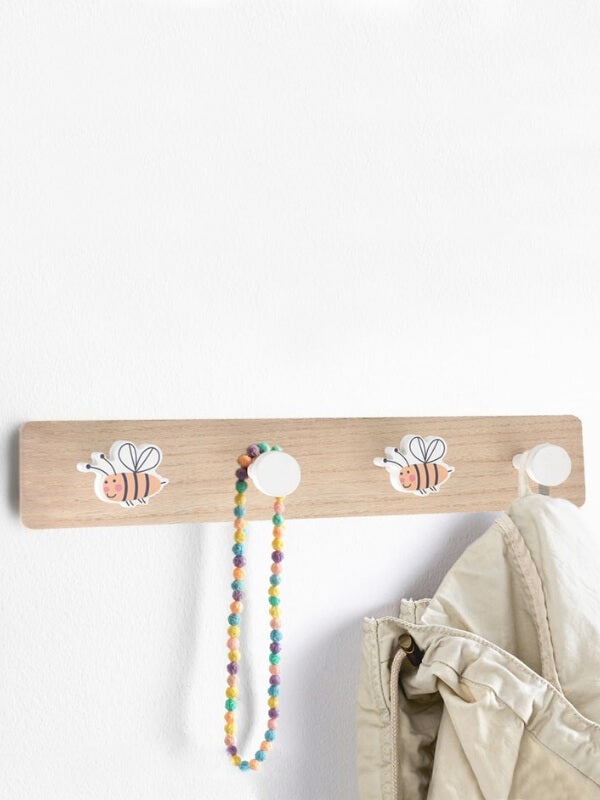 Add a touch of fun and colour to your kid's room by keeping things organized using these eco-friendly kids wall coat hooks. This vibrant coat rack of a design is followed by a peg to keep it minimal yet fun. The 4 pegs are used to hang your coat, bag, or any other accessory.