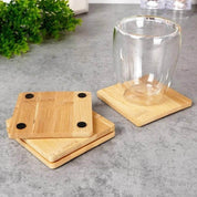 Sustainable Sipping.  Protect your surfaces in style with our natural bamboo coaster set coming in a circle and square shape. Crafted from eco-friendly bamboo, these coasters add a touch of elegance and nature to any room. Includes 4 durable and moisture-resistant coasters to keep your tables and countertops scratch and stain-free.