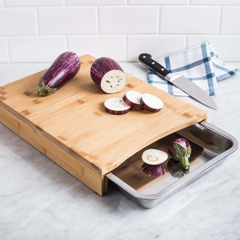 Eco lifestyle - ecolifestyle.shop Eco-Friendly Bamboo Cutting Board with Stainless-Steel Tray built-in stainless steel tray inside the board. Bamboo wood products are eco-friendly from 100% sustainable plantations, top-quality bamboo with little impact on the environment.  Size: 35 x 25 x 4cm. Material: Bamboo and Stainless Steel. 784200220 - 8711295187216