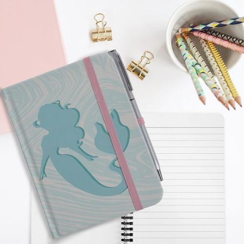 A6 Notebook with Ballpoint pen - Ecolifestyle.shop - Eco Lifestyle - A6 Notebook with a Ballpoint pen - School Notebook with ballpoint pen set - This stylish mermaid design notebook. It has a beautifully illustrated cover page and has 96 pages. This A5 notebook has an elastic band is perfect for notes and drawing art. It comes with a matching ballpoint pen which can clip onto the notebook.